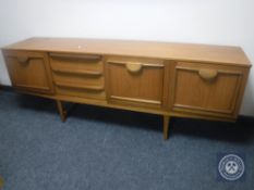 A 1970's teak cocktail sideboard