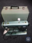 A mid 20th century Husqvarna cased electric sewing machine