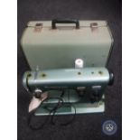 A mid 20th century Husqvarna cased electric sewing machine