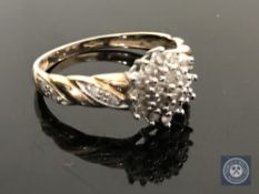 A 9ct gold diamond set cluster ring, size L CONDITION REPORT: 2.