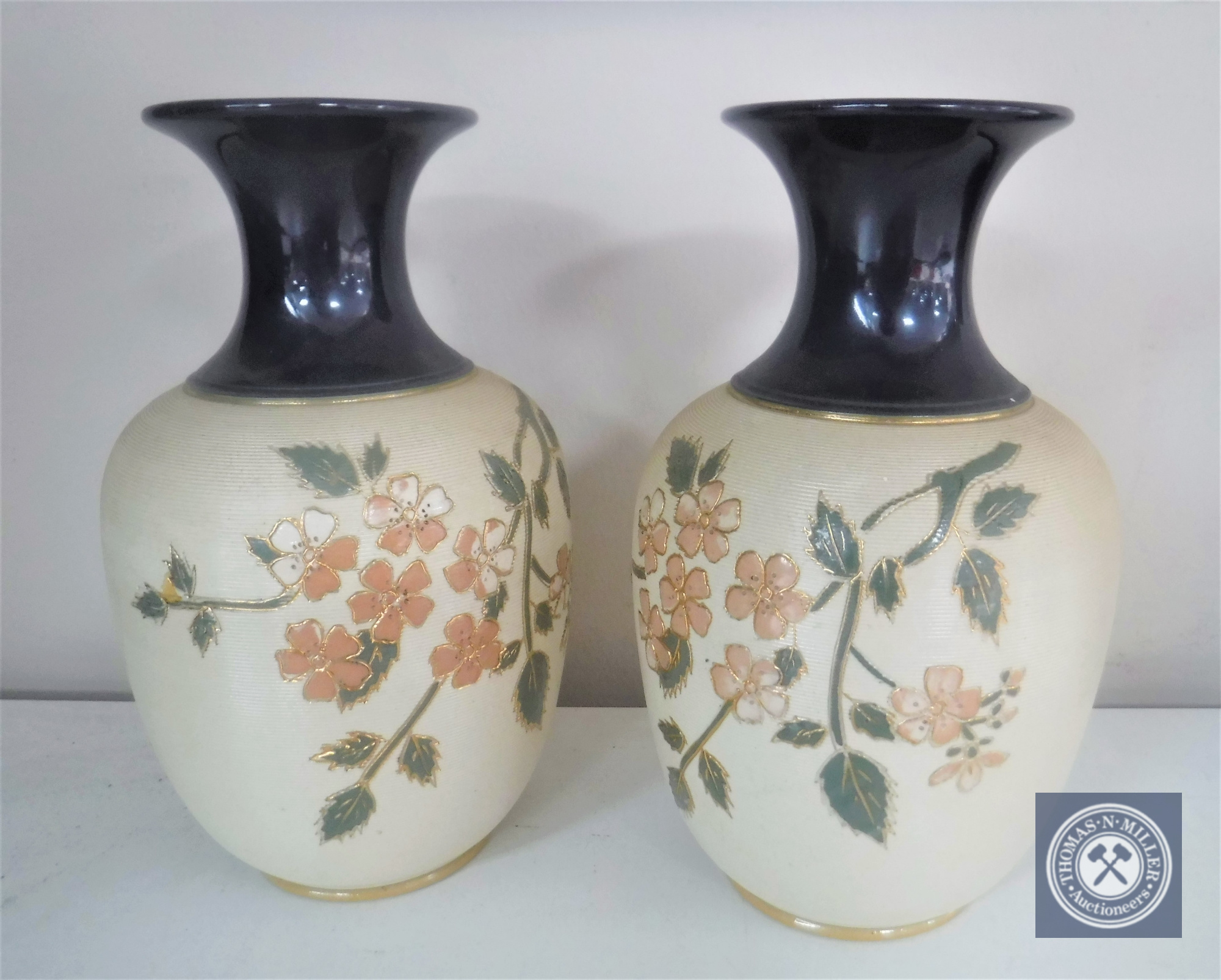 A pair of Royal Doulton glazed pottery vases,