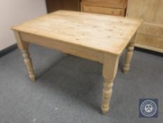 An early 20th century pine farmhouse dining table CONDITION REPORT: 121cm long by