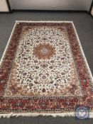 A Keshan rug on ivory ground 300 cm x 200 cm