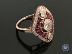 A 14ct rose gold ruby and diamond ring, featuring 1 round brilliant cut diamond 0.