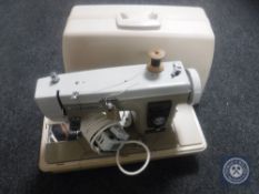 A cased Newholme sewing machine
