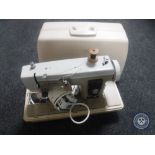 A cased Newholme sewing machine