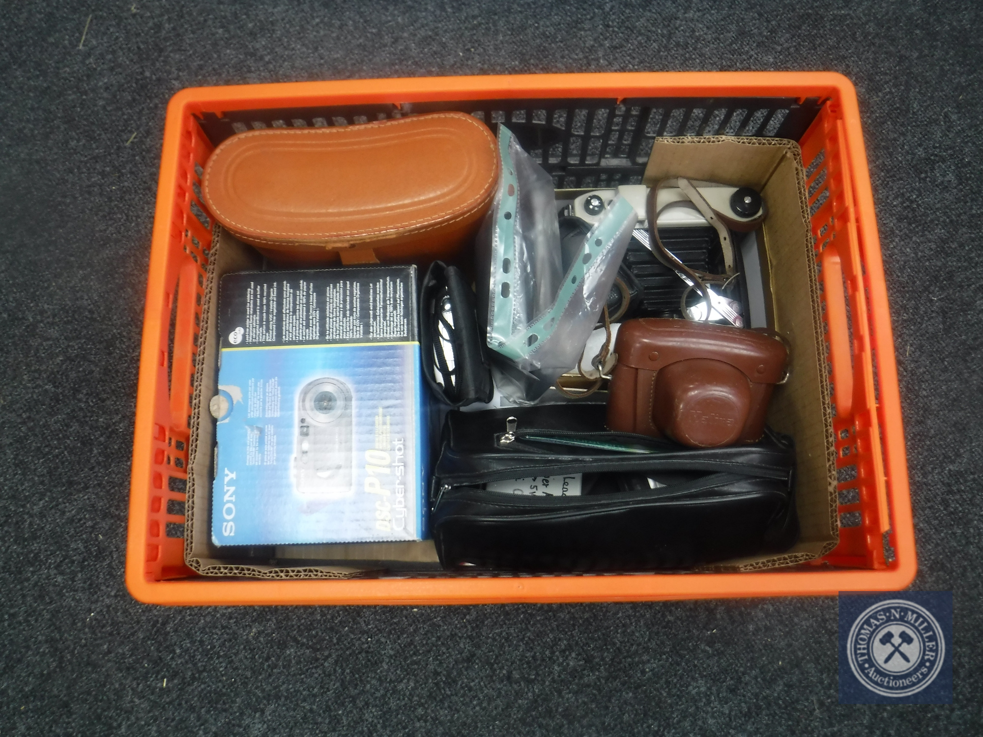 A box of cased Omega 30 x 50 binoculars IM sport binoculars and digital cameras by Sony,