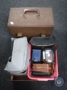 A box containing LP's, projector, cased binoculars,