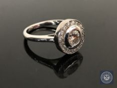 An 18ct white gold diamond ring featuring one round brilliant cut diamond 0.
