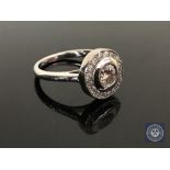 An 18ct white gold diamond ring featuring one round brilliant cut diamond 0.