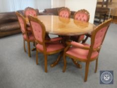 An oval Italian style pedestal dining table together with a set of six chairs
