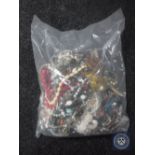 A bag containing a large quantity of costume jewellery