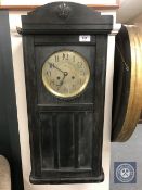 A continental oak cased eight day wall clock with brass dial