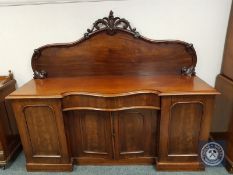 A Victorian mahogany serpentine fronted chiffonier,