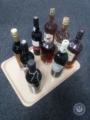 A tray of nine assorted bottles of alcohol and wines including Bumbu rum,