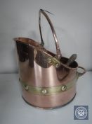 A Victorian copper and brass swing-handled coal bucket with shovel