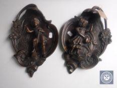A pair of continental bronze wall plaques