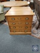 An early twentieth century oak four drawer plan chest,