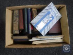 A box of vintage books and ordinance survey maps