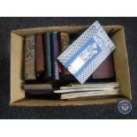 A box of vintage books and ordinance survey maps