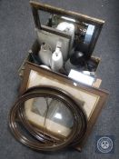A box of vintage door handles, wall clock, lamps, glass bottles,