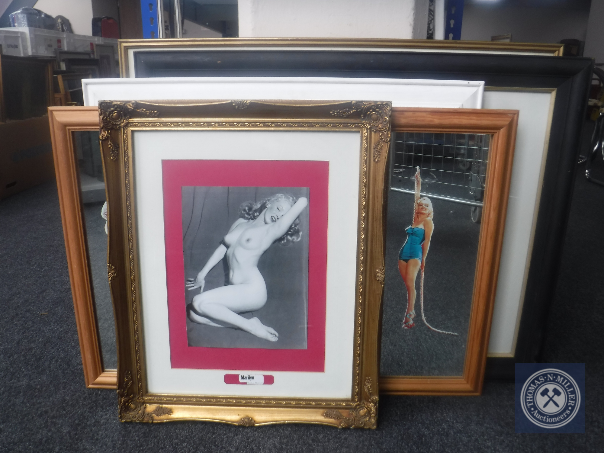 A Marylin Monroe canvas together with three framed pictures and two mirrors