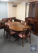 A mahogany G-Plan oval extending dining table together with a set of six chairs