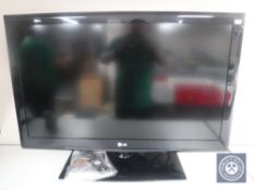 An LG model 37-LE450 37" TV with universal remote
