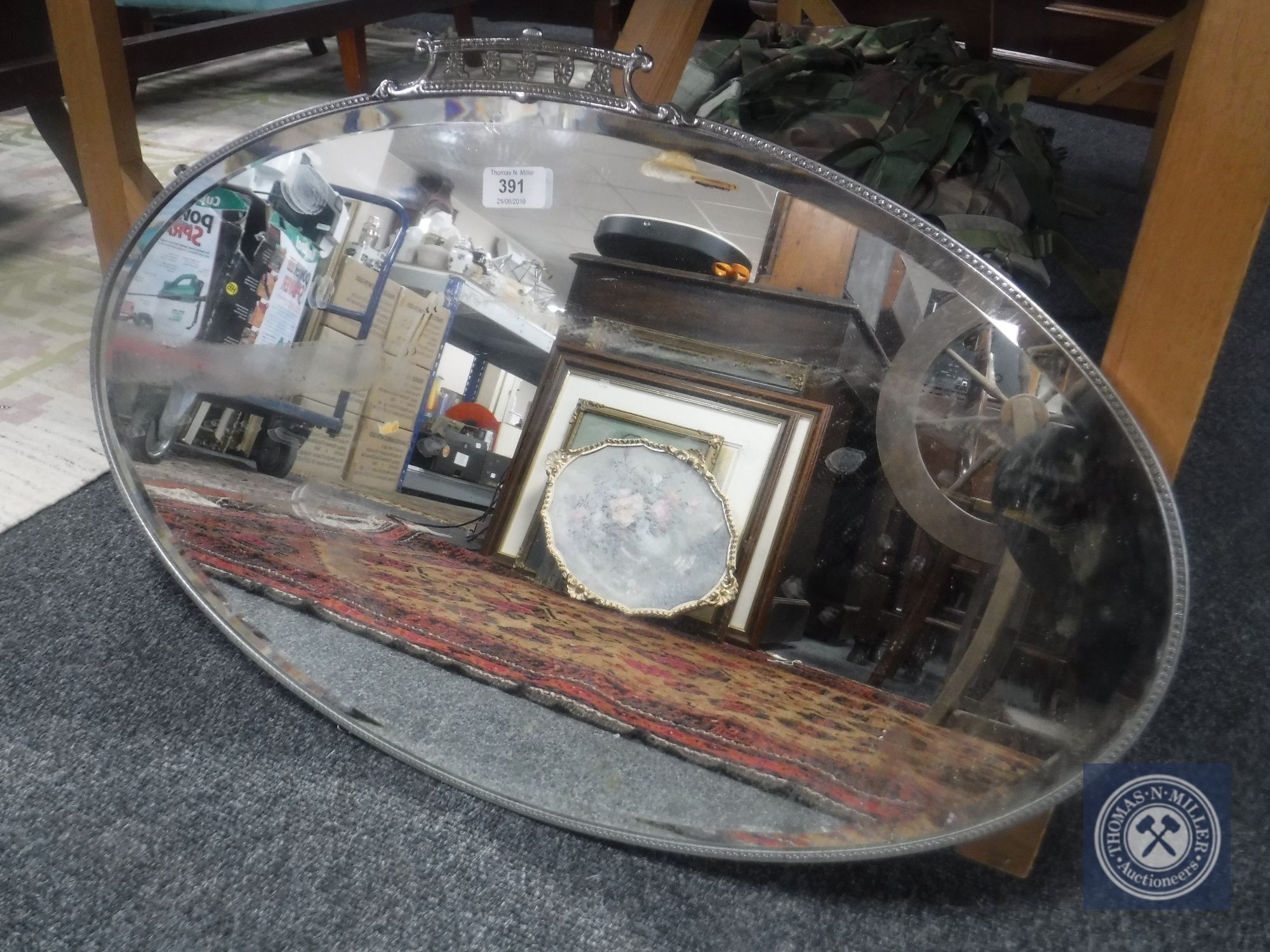 An early 20th century chrome framed mirror and an unframed mirror