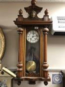 A 20th century mahogany cased eight day wall clock with enamelled dial