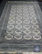 A Bokhara design rug on cream ground,
