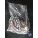 A bag containing a large quantity of costume jewellery