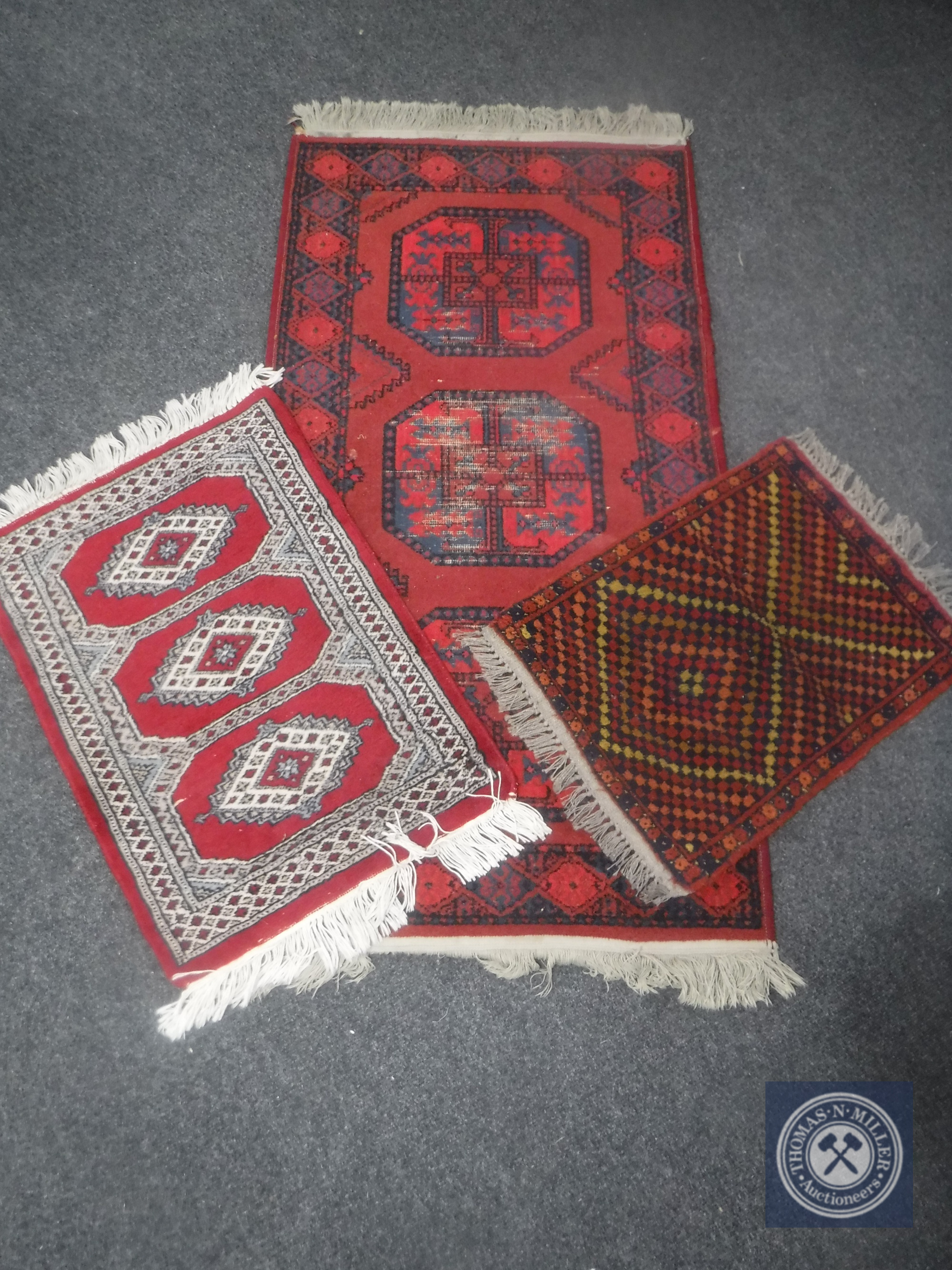 Three Eastern rugs