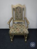 A painted oak tapestry upholstered armchair