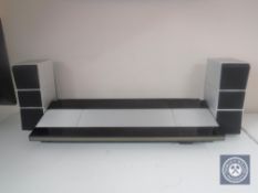 A Bang & Olufsen Beocentre 9000 together with a pair of Beovox 100 speakers (continental wiring)