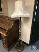 A 20th century standard lamp with shade