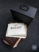 A box and leather folder containing sheet music together a case containing classical LP's