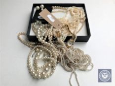 A box of lady's cocktail watch and a quantity of pearl necklaces