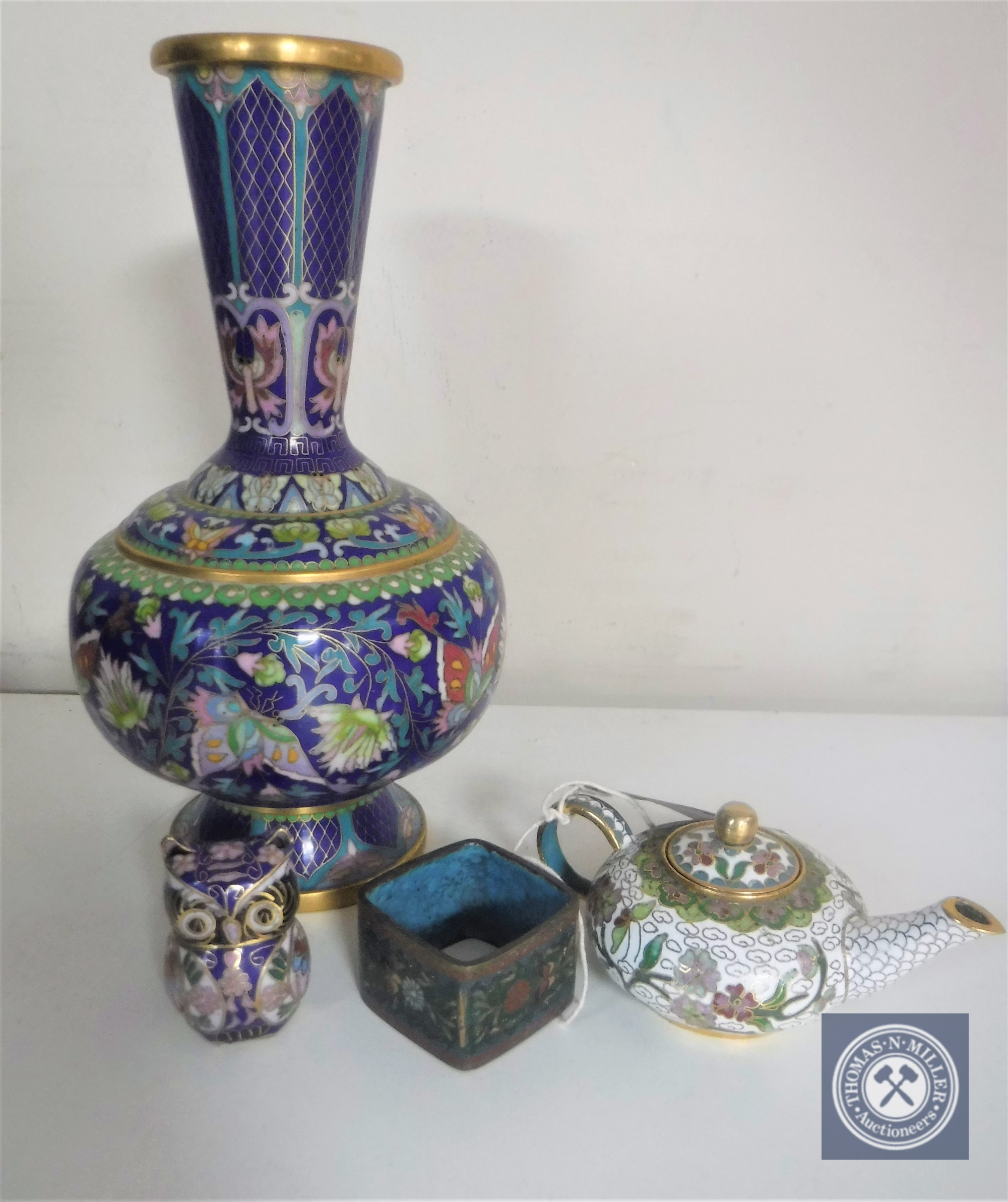 Four pieces of cloisonne including miniature teapot, napkin ring, figure of an owl and a vase,