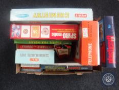 A box of mid 20th century and later board games, Merit chemistry set and microscope set,