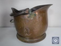A Victorian copper coal helmet