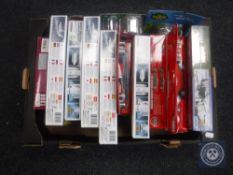 A box of Airfix and Academy model kits,