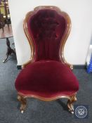 A Victorian mahogany lady's chair in maroon buttoned dralon