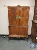 A flame mahogany Queen Anne style cocktail cabinet, width 90 cm.