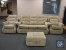 A three-piece lounge suite in beige upholstery,