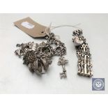 A silver gate bracelet together with a silver charm bracelet with charms