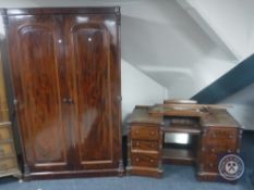 A Victorian mahogany double door wardrobe and kneehole dressing table