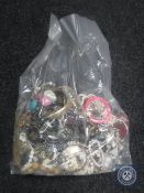 A bag containing a large quantity of costume jewellery