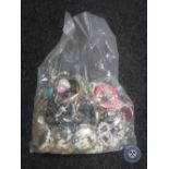 A bag containing a large quantity of costume jewellery