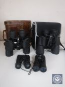 Four sets of binoculars including Praktica, Tasco etc,